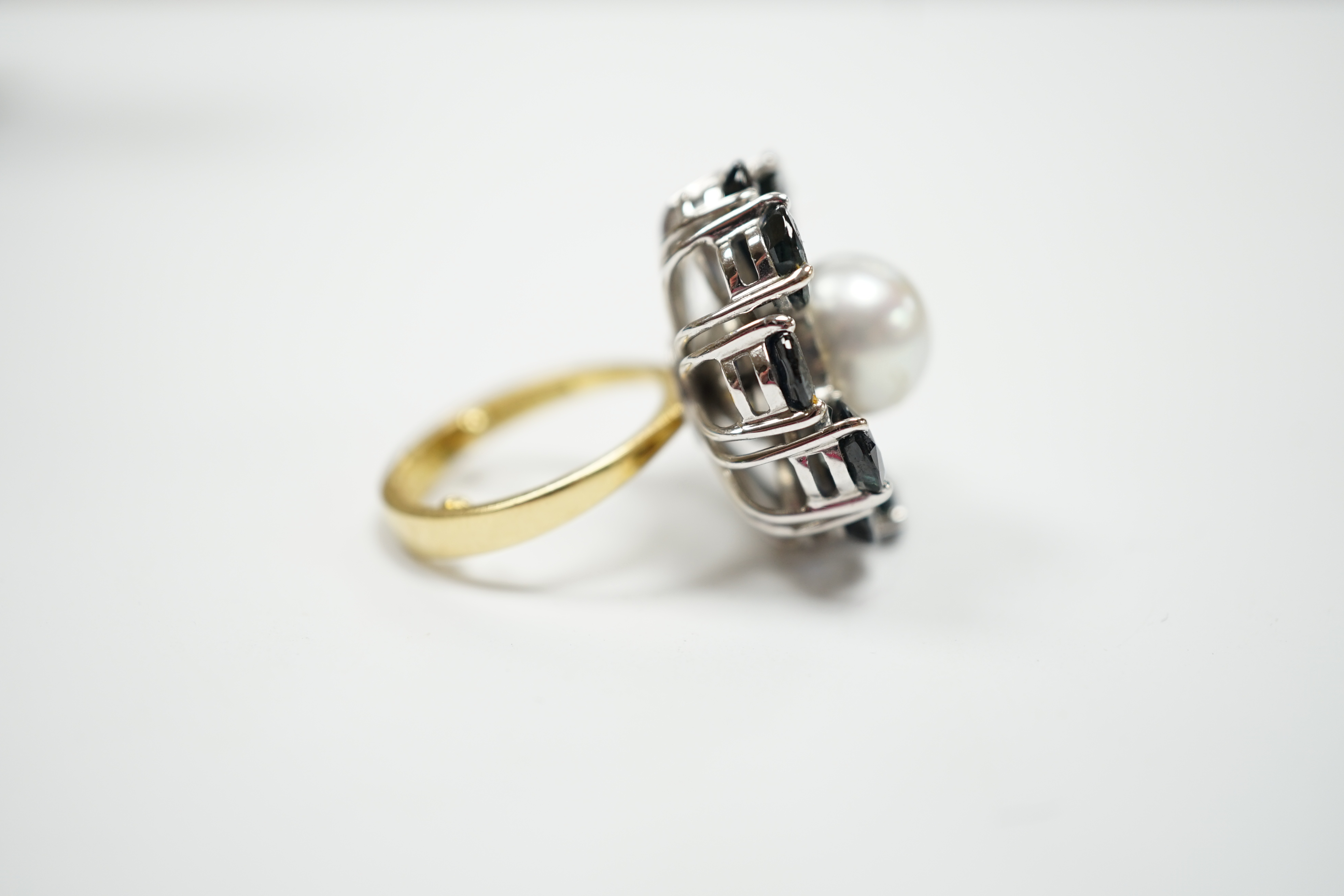 A modern large 18ct gold, single stone cultured pearl and ten stone pear cut sapphire set flower head cluster ring, size G, gross weight 15.4 grams.